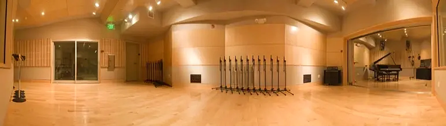 Studio A Tracking Room with hardwood floors and grand piano